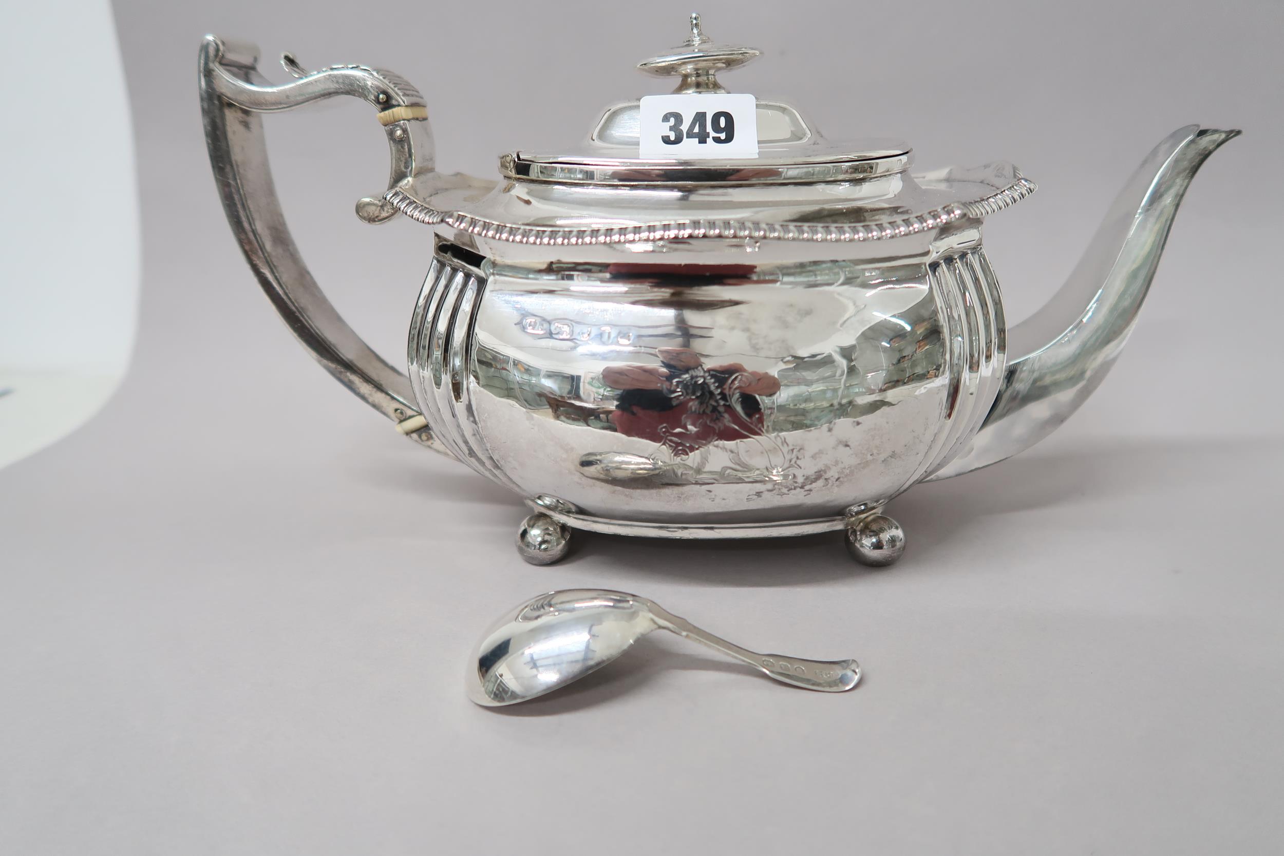 A silver tea pot and a silver caddy spoon - approx weight 22 troy oz - hallmarks rubbed