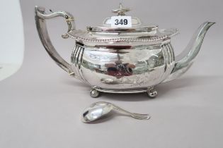 A silver tea pot and a silver caddy spoon - approx weight 22 troy oz - hallmarks rubbed