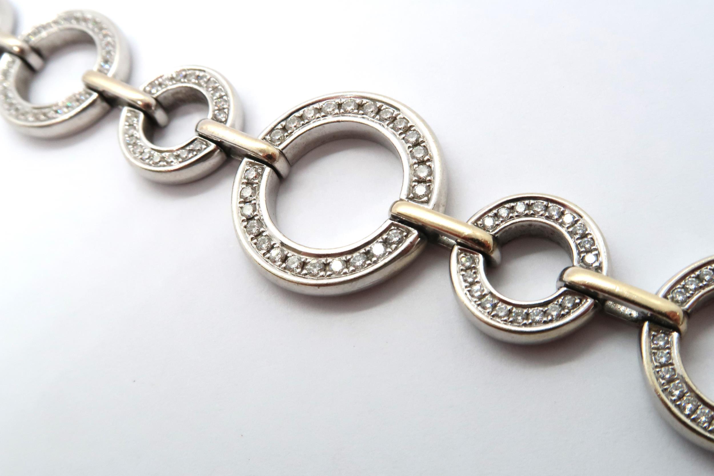 An 18ct white gold diamond set Boodles 'Roulette' bracelet, grain set with round brilliant cut - Image 2 of 6