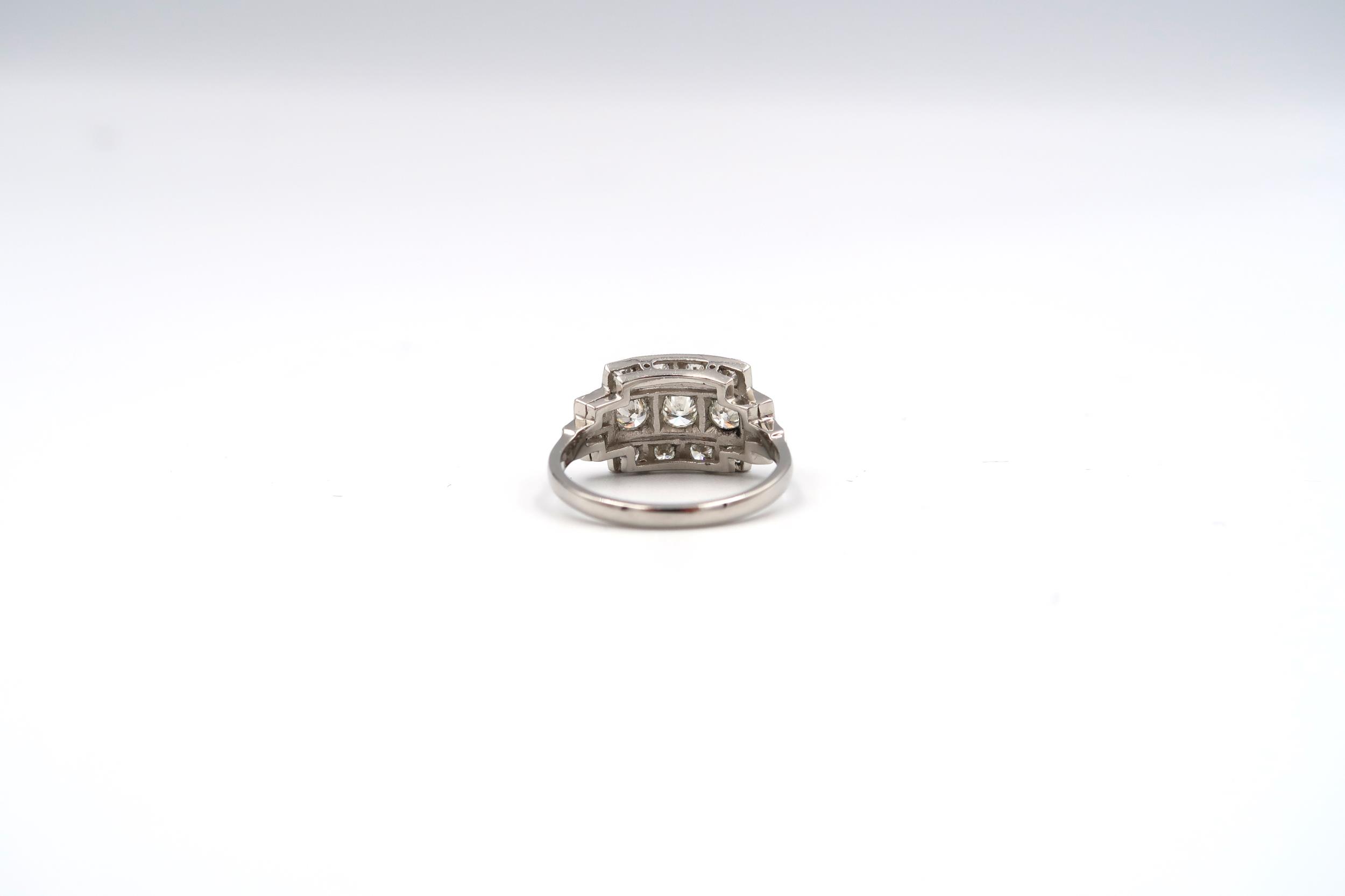 An Art Deco style platinum three row diamond ring with diamond shoulders - diamond weight approx 1. - Image 3 of 3