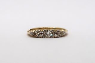 An 18ct yellow gold Edwardian 5 stone diamond ring, diamonds are well matched, head size approx 16mm