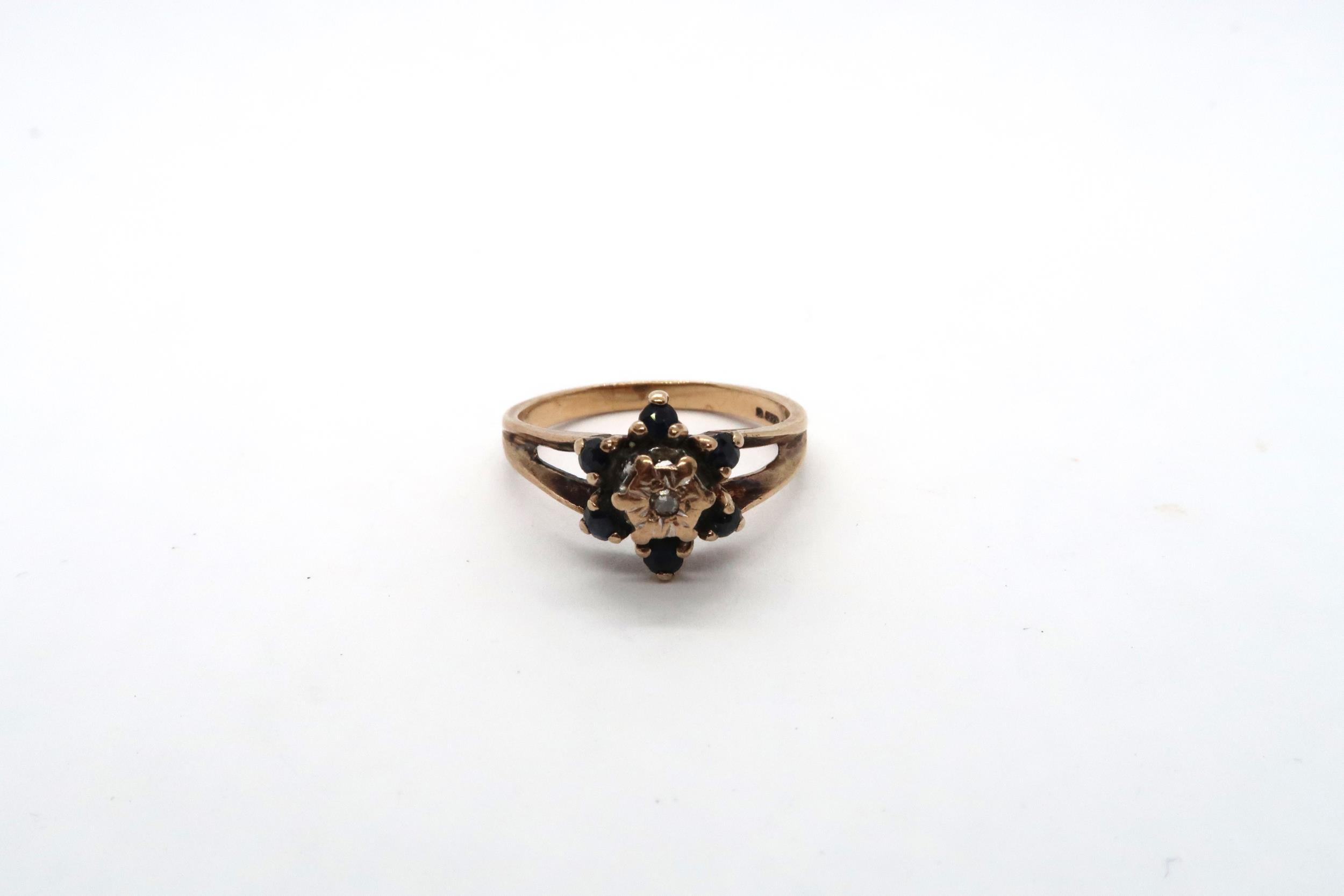 A 9ct diamond and sapphire rose gold cluster ring, size N