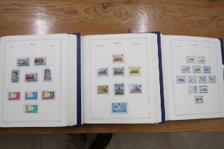 Three stamp albums including stamps from Guernsey, Isle of Man and Jersey 1950s - 1990s