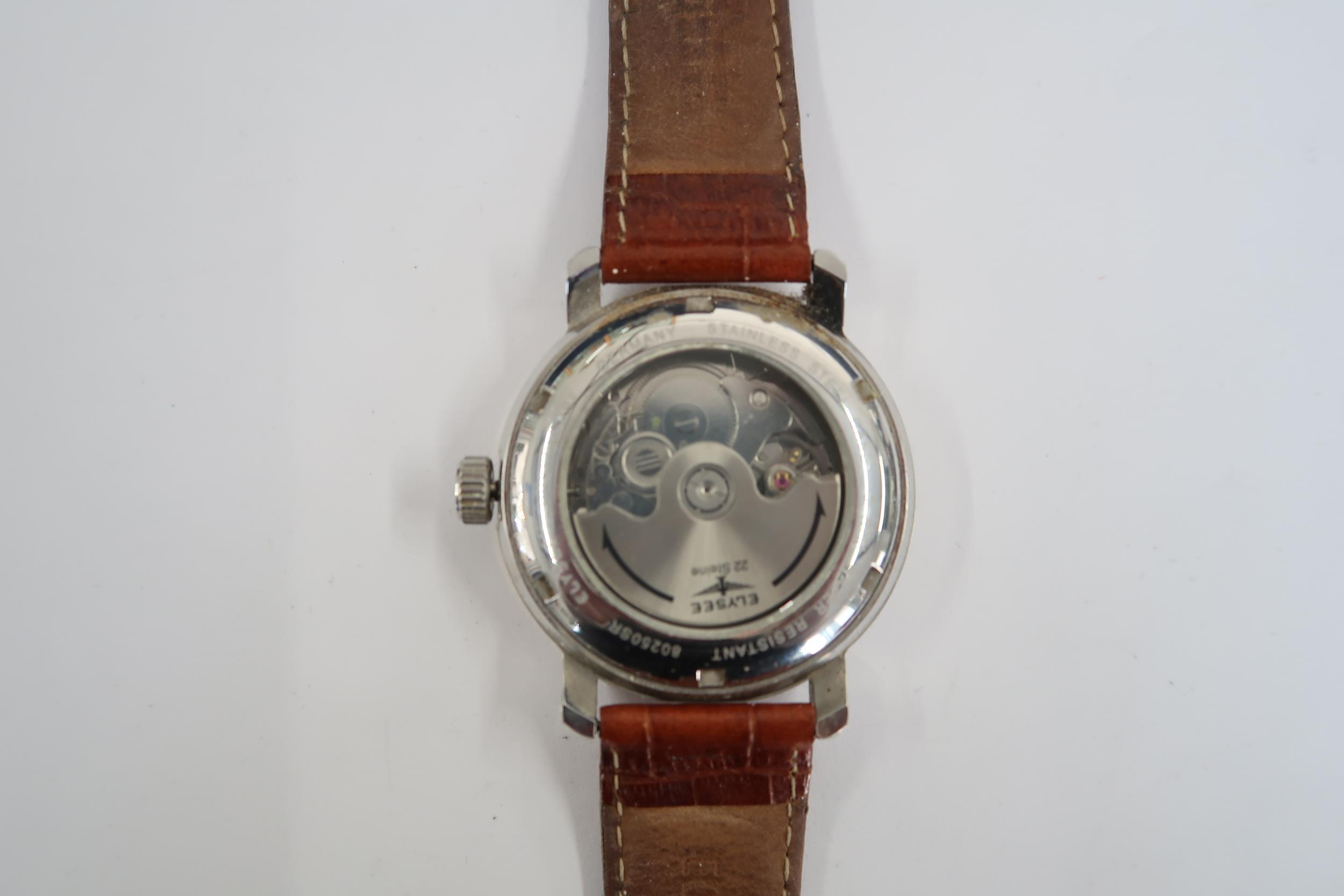 A Gents Elysee auto day/date watch on a brown leather strap, running in saleroom - Image 2 of 3