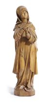 A CONTINENTAL BOXWOOD FIGURE OF THE VIRGIN MARY 19TH CENTURY modelled standing clasping her hands