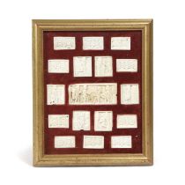 A FRAMED SET OF BONE PLAQUES 19TH / 20TH CENTURY depicting various rural domestic scenes, surrounded