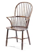 A YEW AND ELM STICK BACK WINDSOR ARMCHAIR EARLY 19TH CENTURY the saddle seat above turned legs,