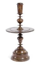 A TREEN HARDWORD CANDLESTICK POSSIBLY DUTCH, 17TH CENTURY with a tapering nozzle above a turned stem