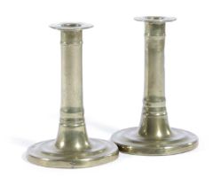 A NEAR PAIR OF WILLIAM AND MARY BRASS TRUMPET CANDLESTICKS LATE 17TH CENTURY each with a plain