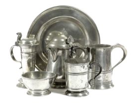 A GERMAN PEWTER STEIN INSCRIBED HINRICH ARTENS ,1668 of tapering form with a domed cover, scroll