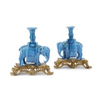 A PAIR OF CHINESE ORMOLU MOUNTED POTTERY MODELS OF ELEPHANTS LATE 19TH CENTURY standing four square,