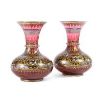 A PAIR OF BOHEMIAN RUBY GLASS ENAMELLED VASES 19TH CENTURY decorated with bands of animals in gilt