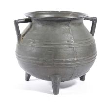 A BRONZE CAULDRON 17TH CENTURY with a flared rim, and angular lug handles, with banded decoration