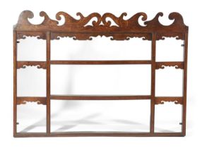 A GEORGE II OAK AND ELM DELFT RACK MID-18TH CENTURY with a pierced fret surmount 108.4cm high, 148.