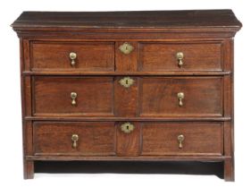 A WILLIAM AND MARY OAK CHEST LATE 17TH CENTURY BUT LATER ADAPTED with two short and two long drawers