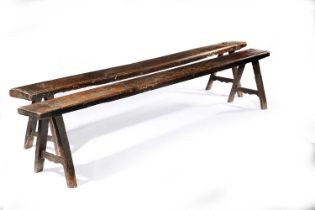 A PAIR OF OAK FORMS OR LONG BENCHES LATE 18TH / EARLY 19TH CENTURY on 'A' frame legs with shaped