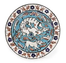 A POTTERY IZNIK STYLE CHARGER PROBABLY FRENCH, 19TH CENTURY painted in blue, turquoise, red and
