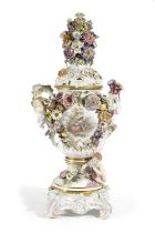 A VERY LARGE MEISSEN PORCELAIN VASE WITH COVER AND STAND 19TH CENTURY painted with a panel of