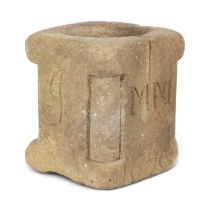 A WILLIAM III SANDSTONE MORTAR OR POST SOCKET DATED '1696' of square section, the front corners with