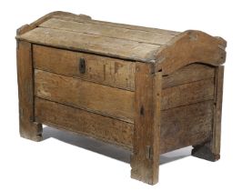 AN ELIZABETH I OAK MEAL CHEST OR ARK C.1600 the domed top with overlapping boards above a conforming