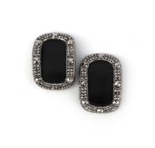 A pair of cut steel shoe buckles, early 19th century, each of oval outline, the centres with a