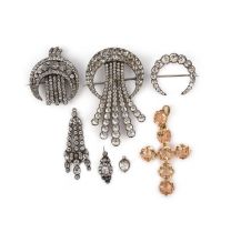 Four brooches and three pendants, 19th century, comprising: three brooches of crescent moon motif,