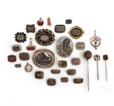 λ A large group of jewels, 19th century, comprising: 22 mourning jewels containing woven hairwork,
