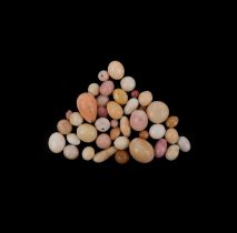 A selection of 34 untested pearls including conch pearls and other non nacreous pearls