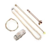 A mixed group of jewels, comprising: a rose gold charm bracelet suspending three charms depicting