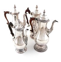 A collection of four George III old Sheffield plated coffee pots, comprising: three of baluster