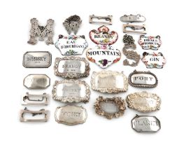 A collection of wine and boudoir labels, comprising silver ones: a pair of cut-out letters 'S'