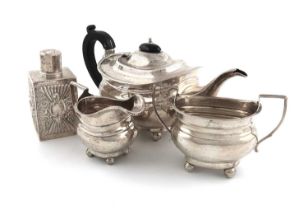 A three-piece silver tea set, by Henry Williamson Ltd., Birmingham 1920, oblong bellied form,