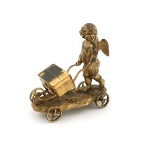 A Victorian gilt metal cherub and wheelbarrow box, by Elkington and Co, 1843, the cherub pushing the