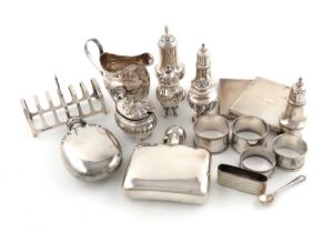 A mixed lot of silver items, comprising: a George III cream jug, London 1801, two hipflasks, a toast