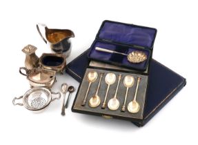 A mixed lot of silver items, various dates and makers, comprising: a George III silver cream jug,