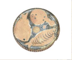 A Campanian red figure pottery fish plate circa 4th century BC decorated with three fish and a