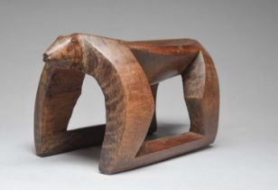An Amazon zoomorphic stool Venezuela carved as a jaguar, 16cm high, 34cm long.
