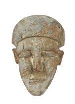 An Egyptian wood sarcophagus mask Late Period, circa 664 - 30 BC with remains of gesso and