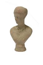 A Roman terracotta bust of a lady Hadrianic Period, circa 130 - 140 AD wearing a braided headdress