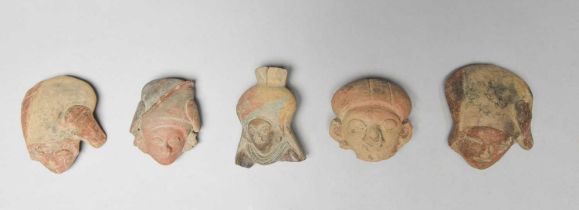 Five Jama Coaque female pottery heads Ecuador, circa 500 BC with pigment decoration and one with
