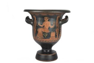 A Greek red figure bell krater circa 4th century BC painted on one side a seated bare chested female