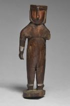 A Kuna standing figure San Blas Islands, Panama with cropped hair and red pigment to the face and