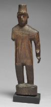 A Kuna standing figure San Blas Islands, Panama wearing a hat and missing the right arm, 29.5cm