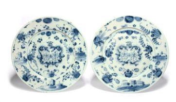 A pair of large Savona maiolica armorial chargers, 18th century, painted in blue with a double