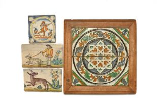 A pair of Spanish cuerda seca ceiling tiles framed as a plaque, probably 16th century, decorated