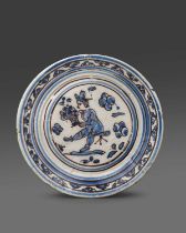 A Portuguese faïence charger, late 17th century, painted in blue and manganese with a European