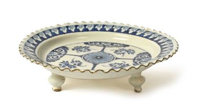 A rare delftware stand, c.1710-30, probably London or Vauxhall, the circular top painted in blue