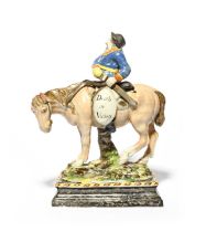 A Wood family pearlware equestrian model of Hudibras, early 19th century, the heroic knight