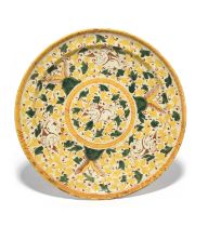 An early Delft charger, mid 17th century, probably Haarlem, painted in red, yellow and green with