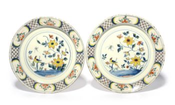 A pair of delftware chargers, c.1730-40, probably Bristol, each painted in polychrome enamels with a